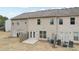 A spacious backyard featuring a patio, seating and rear exterior of home at 2785 Maple Park Pl, Cumming, GA 30041