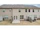 A spacious backyard featuring a patio, seating and rear exterior of home at 2785 Maple Park Pl, Cumming, GA 30041