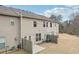 A view of a backyard with the exterior of a townhome and a wood privacy fence at 2785 Maple Park Pl, Cumming, GA 30041