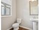 Charming powder room featuring a pedestal sink and a decorative mirror at 2785 Maple Park Pl, Cumming, GA 30041