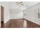 Bedroom with dark wood floors, a ceiling fan and lots of natural light at 2785 Maple Park Pl, Cumming, GA 30041