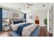 Bedroom with ceiling fan, ensuite bathroom, and blue decor at 2785 Maple Park Pl, Cumming, GA 30041