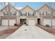 Charming townhome featuring a one car garage and inviting brick and siding exterior at 2785 Maple Park Pl, Cumming, GA 30041