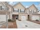 Charming two-story townhome with a one car garage, and well-manicured landscaping at 2785 Maple Park Pl, Cumming, GA 30041