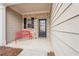 Charming front porch with a red bench, brick detail, and black front door at 2785 Maple Park Pl, Cumming, GA 30041