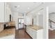 Spacious kitchen with granite countertops, stainless appliances and hardwood floors at 2785 Maple Park Pl, Cumming, GA 30041