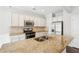 Updated kitchen features granite countertops, stainless steel appliances and a dual basin sink at 2785 Maple Park Pl, Cumming, GA 30041