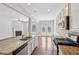 Open concept kitchen with a center island, stainless appliances and view of the living room fireplace at 2785 Maple Park Pl, Cumming, GA 30041