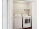 Laundry room with a washer and dryer, and white folding doors at 2785 Maple Park Pl, Cumming, GA 30041