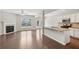 Spacious open floorplan combines a living room with fireplace to a kitchen with granite countertops at 2785 Maple Park Pl, Cumming, GA 30041
