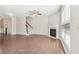 Spacious living room with hardwood floors, a fireplace, and staircase at 2785 Maple Park Pl, Cumming, GA 30041
