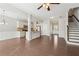 Open concept floorplan features a kitchen and dining area with hardwood floors and access to the staircase at 2785 Maple Park Pl, Cumming, GA 30041