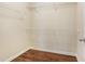 Empty walk-in closet featuring wood-look floors and white wire shelving at 2785 Maple Park Pl, Cumming, GA 30041