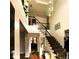 Bright, airy foyer with hardwood floors, staircase, and chandelier at 709 Eastwood Rise, Stone Mountain, GA 30087