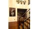 Bright foyer with hardwood floors, modern art, black iron staircase, and contemporary decor at 709 Eastwood Rise, Stone Mountain, GA 30087