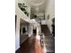 A grand foyer with hardwood floors, a staircase, and a chandelier at 709 Eastwood Rise, Stone Mountain, GA 30087