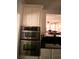 Modern kitchen showcasing stainless steel double ovens at 709 Eastwood Rise, Stone Mountain, GA 30087