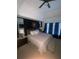 Stylish main bedroom with king-sized bed, dark accent wall, and contemporary lighting at 709 Eastwood Rise, Stone Mountain, GA 30087