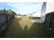 This backyard features a fenced yard with mature trees, providing a private outdoor oasis at 838 Roxholly Ln, Buford, GA 30518