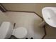 Bathroom features a pedestal sink, toilet, and ceramic tile flooring at 838 Roxholly Ln, Buford, GA 30518