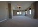 Spacious bedroom featuring neutral walls, carpet, lots of natural light, and a ceiling fan at 838 Roxholly Ln, Buford, GA 30518