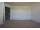 Bright bedroom with neutral carpet, cream walls and doorways to other areas of the house at 838 Roxholly Ln, Buford, GA 30518