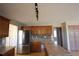 Kitchen with stainless steel refrigerator, wood cabinets, and lots of counter space at 838 Roxholly Ln, Buford, GA 30518