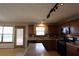 Kitchen featuring stainless appliances, wood cabinets, an island, and track lighting at 838 Roxholly Ln, Buford, GA 30518