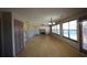 Spacious living room boasts wood-look floors, fireplace, many windows, and plenty of natural light at 838 Roxholly Ln, Buford, GA 30518