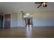 Bright living room features wood floors, neutral walls, ceiling fan, and staircase at 838 Roxholly Ln, Buford, GA 30518