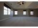 Expansive primary bedroom with ceiling fan, recessed tray ceiling, and natural light at 838 Roxholly Ln, Buford, GA 30518