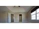 Spacious main bedroom with plush carpet, ceiling fan, and tray ceiling at 838 Roxholly Ln, Buford, GA 30518