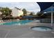 Community swimming pool with comfortable lounge chairs at 838 Roxholly Ln, Buford, GA 30518