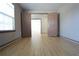 Room with french doors, natural light from a window, and beautiful wood flooring at 838 Roxholly Ln, Buford, GA 30518