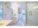 Spacious bathroom featuring double sinks, a glass-enclosed shower, and a soaking tub for relaxation at 1881 Edinburgh Ne Ter, Atlanta, GA 30307