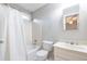 Bright bathroom featuring a shower with a white shower curtain and a white vanity at 1881 Edinburgh Ne Ter, Atlanta, GA 30307
