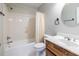 Clean bathroom featuring shower-tub combo, and single wooden sink vanity at 1881 Edinburgh Ne Ter, Atlanta, GA 30307
