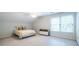 Bright bedroom with natural light, neutral carpet and modern minimalist decor at 1881 Edinburgh Ne Ter, Atlanta, GA 30307