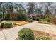 Beautiful home with a sprawling driveway, lush lawn, and mature landscaping enhancing curb appeal at 1881 Edinburgh Ne Ter, Atlanta, GA 30307