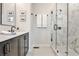 Modern bathroom featuring a glass shower with marble tile and a sleek vanity with black fixtures at 4454 Dandelion Ln, Atlanta, GA 30342