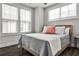 Cozy bedroom with hardwood floors, natural light from large windows, and neutral decor at 4454 Dandelion Ln, Atlanta, GA 30342