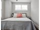 Bedroom with hardwood floors, neutral decor, with natural light streaming through the window at 4454 Dandelion Ln, Atlanta, GA 30342