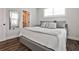 Comfortable bedroom featuring neutral tones, large windows for natural light, and hardwood floors at 4454 Dandelion Ln, Atlanta, GA 30342
