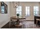 Bright dining area featuring a round table with clear chairs and contemporary lighting at 4454 Dandelion Ln, Atlanta, GA 30342