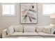 Stylish living room with modern art, a comfortable sofa, and plenty of natural light from large windows at 4454 Dandelion Ln, Atlanta, GA 30342