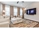 Modern living room with a large sofa, area rug, neutral tones, and lots of natural light at 4454 Dandelion Ln, Atlanta, GA 30342