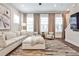Bright living room features modern furnishings, neutral color palette, and an abundance of natural light at 4454 Dandelion Ln, Atlanta, GA 30342