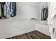 Spacious walk-in closet with custom shelving and hardwood floors for organized storage at 4454 Dandelion Ln, Atlanta, GA 30342