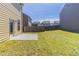 Spacious backyard featuring a concrete patio and ample space for outdoor activities at 6399 Woodwell Dr, Union City, GA 30291