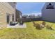 This backyard offers a patio with seating and a fire pit for outdoor enjoyment at 6399 Woodwell Dr, Union City, GA 30291